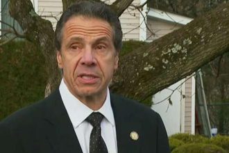 new-york-gov.-cuomo-helps-rescue-trapped-motorist-from-wreck