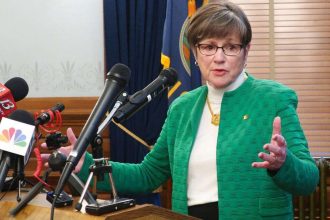 Kansas governor’s decision to close all schools sees GOP pushback