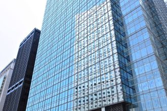 Why are office buildings made of glass