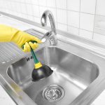 Cleaning the old sinks.