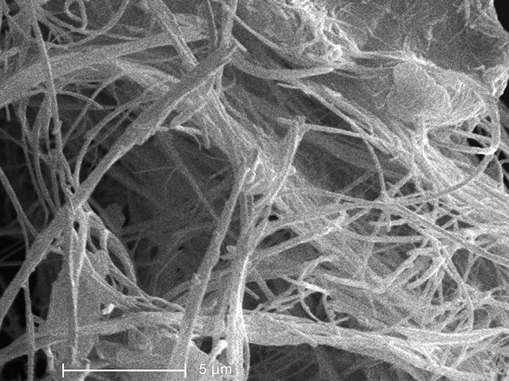 Why was asbestos banned in the UK?