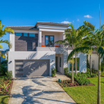 A picture of the home exterior for the GL Homes Caledonia plan at Lotus Palm in the Fiji collection, located in Boca Raton, Florida.