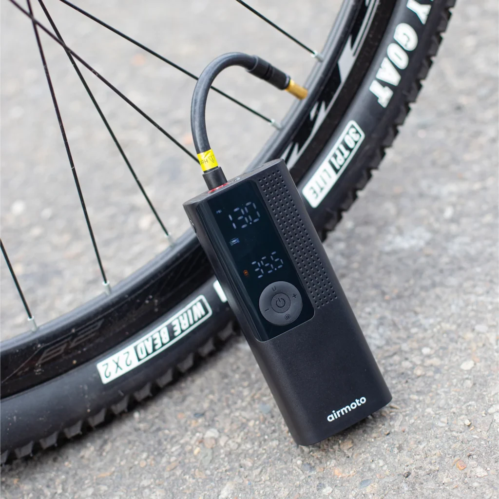 Airtmoto being used to pump bicycle