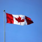 Feature image Alt text: Canadian flag on a pole