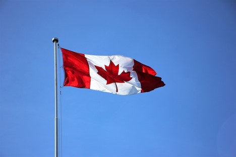 Feature image Alt text: Canadian flag on a pole