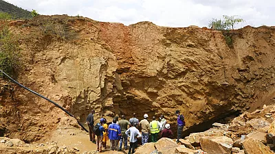 An uncontrolled gold mine in Mali collapsed, leaving more than 70 people dead, according to an official.